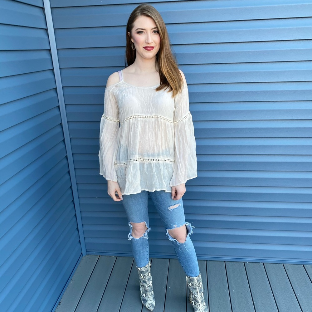 Peek a boo shoulder shirt.